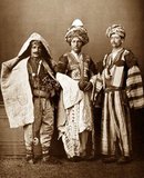 From 'Les Costumes Populaires De La Turquie' (1873). A collection of photographs by the famous photographer Pascal Sebah on the occasion of the universal exposition in Vienna in 1873.<br/><br/>

The album represents the costumes of the different regions, and ethnic and religious groups of the Ottoman Empire. On the right is a Kurd from Aljazeera (Iraq). Center, a Kurd of Mardin (Syria). On the left is a shepherd from the province of Diyarbakir (Turkey).